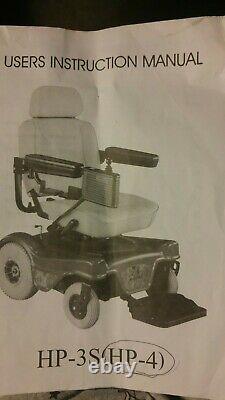Red Rumba power wheelchair (Medical Equipment). Charges and runs good