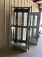 Two medical Stainless Steel pass thru Cabinets 2 doors each side sold separately