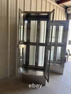 Two medical Stainless Steel pass thru Cabinets 2 doors each side sold separately