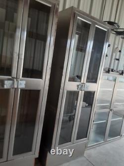 Two medical Stainless Steel pass thru Cabinets 2 doors each side sold separately