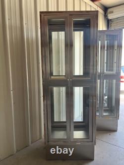 Two medical Stainless Steel pass thru Cabinets 2 doors each side sold separately
