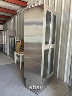 Two medical Stainless Steel pass thru Cabinets 2 doors each side sold separately