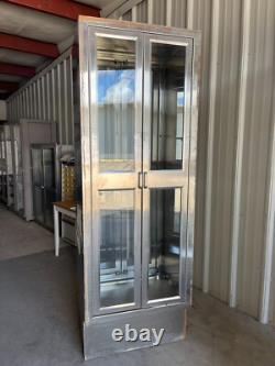 Two medical Stainless Steel pass thru Cabinets 2 doors each side sold separately
