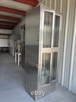 Two medical Stainless Steel pass thru Cabinets 2 doors each side sold separately