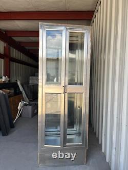 Two medical Stainless Steel pass thru Cabinets 2 doors each side sold separately