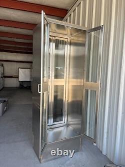 Two medical Stainless Steel pass thru Cabinets 2 doors each side sold separately